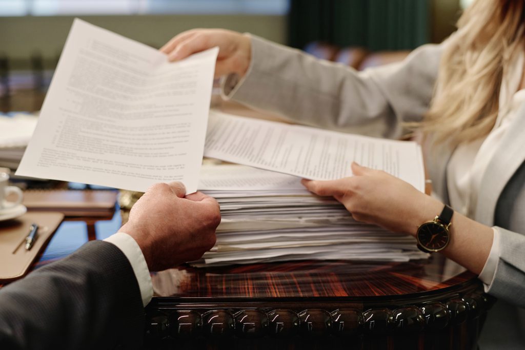 Businesswoman Giving Paper To Her Male Colleague 2024 01 26 13 50 42 Utc